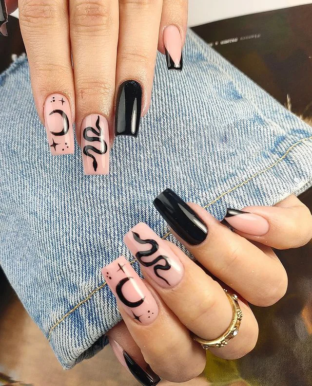 Textured black nails with glittery silver tips