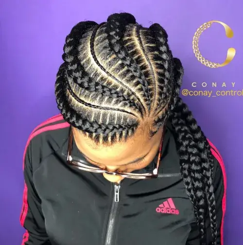 Layered goddess cornrows transitioning into free-flowing twists