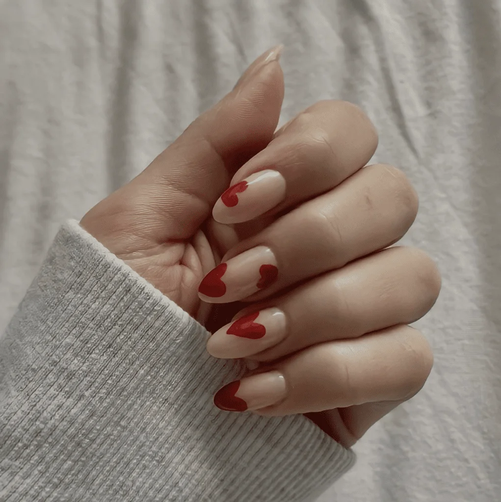 Pastel Pink Valentine’s Nails with Glitter and Hearts