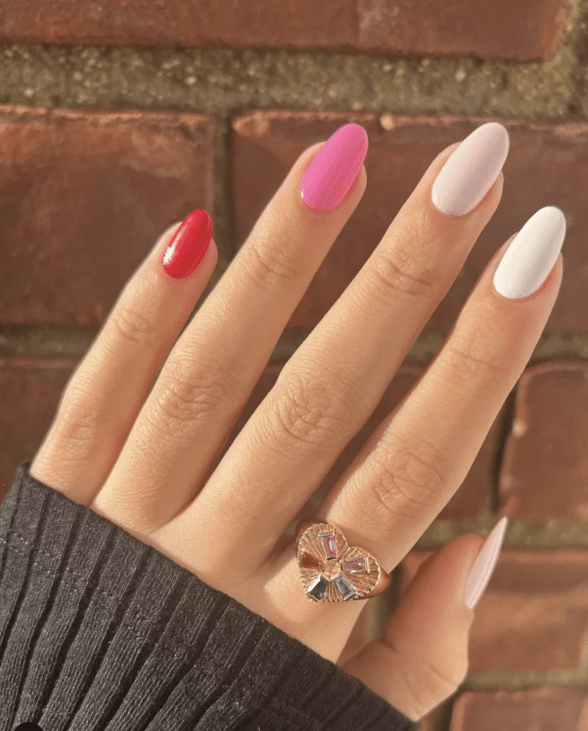 Elegant Pink Valentine’s Nails with Subtle Gold Stripes