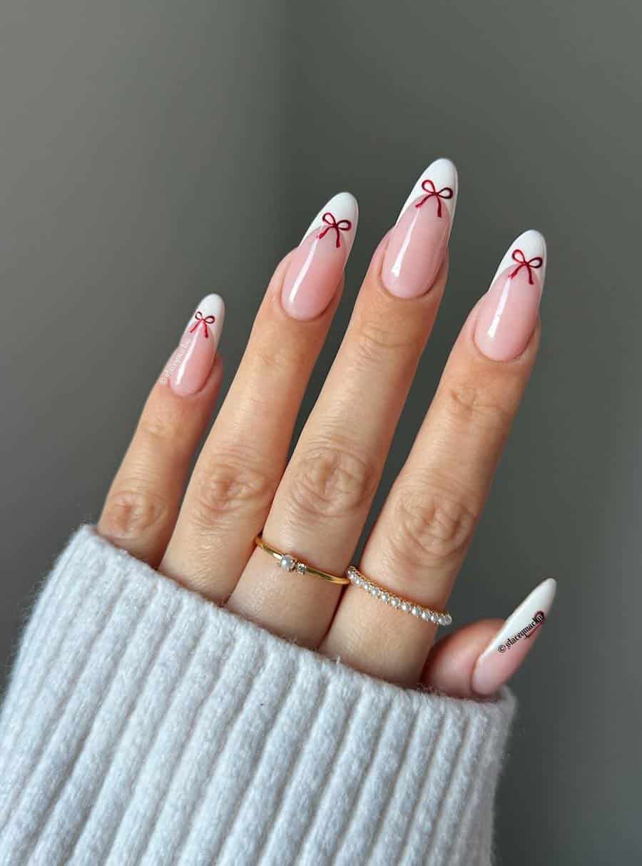 Classic red Christmas nails with gold accents and minimalistic designs