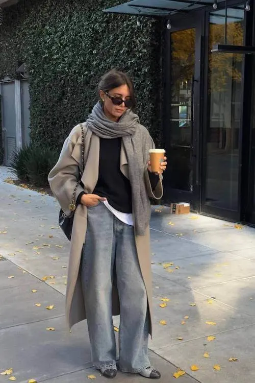 Casual and cozy winter outfit with a neutral coat and scarf