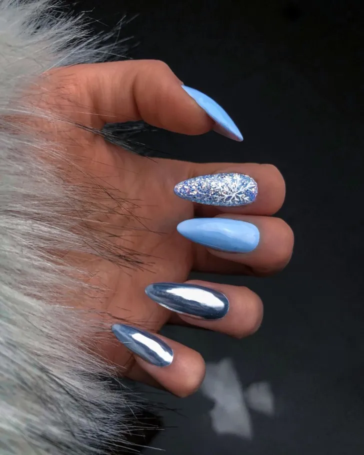 Mismatched Shimmery Blue Nails with Snowflake Accents