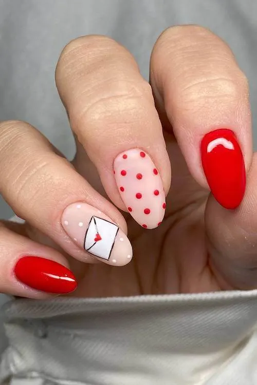 Rosy pink nails with glittery gold accents on Valentine’s Day