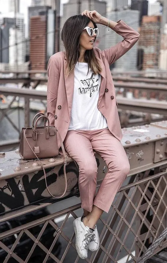 Business casual featuring a fitted blazer and trousers with sneakers