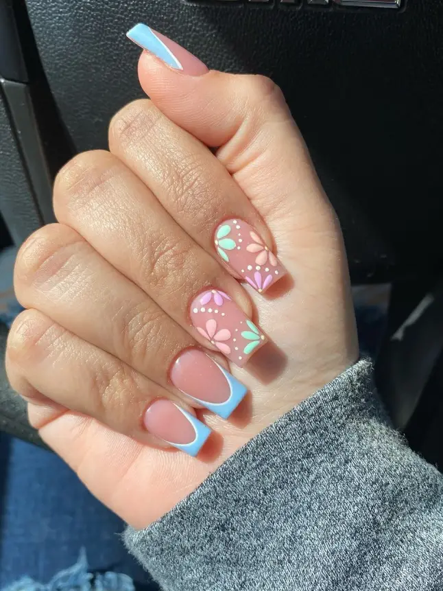 Peach-colored nails adorned with delicate gold foil details