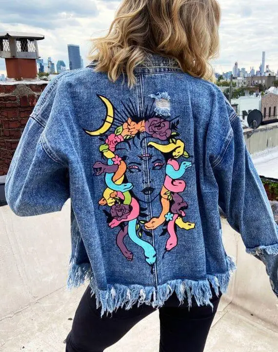 Denim jacket featuring hand-painted butterfly designs on the sleeves and back