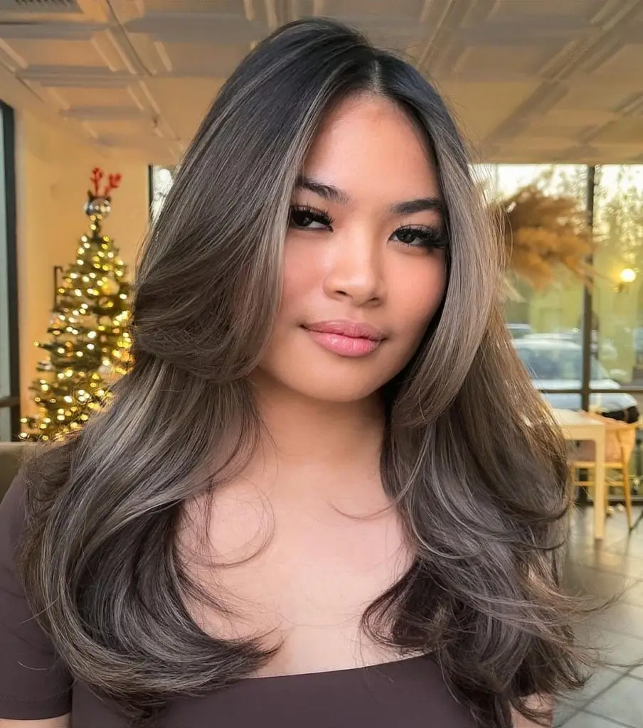 Voluminous Blowout with Chestnut Undertones