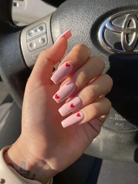 Valentine’s Day nails in shades of pink and red with bold accents